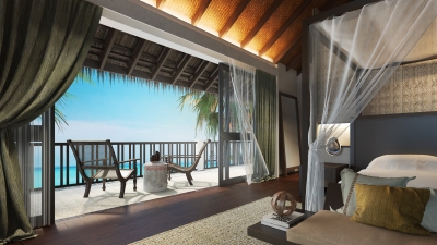 Villa with open-air lounge at Four Seasons Private Island Maldives at Voavah